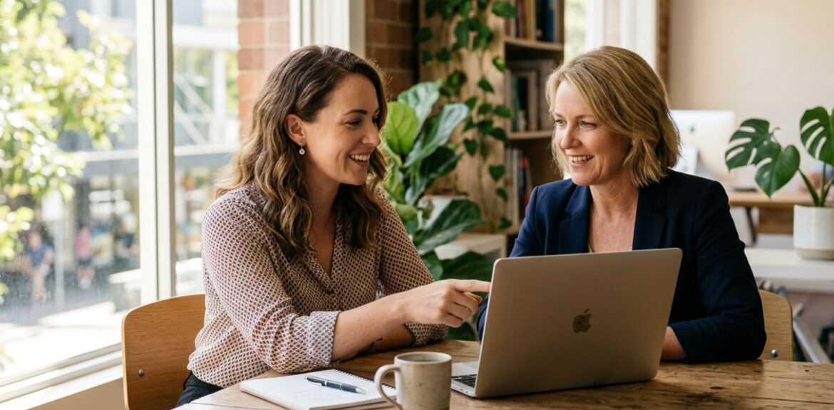 AI Marketing Agency Consultation Meeting Marketing strategist and business owner reviewing AI automation dashboards, representing an ai marketing agency australia bus