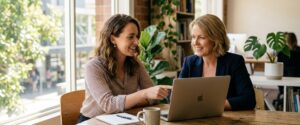 AI Marketing Agency Consultation Meeting Marketing strategist and business owner reviewing AI automation dashboards, representing an ai marketing agency australia bus